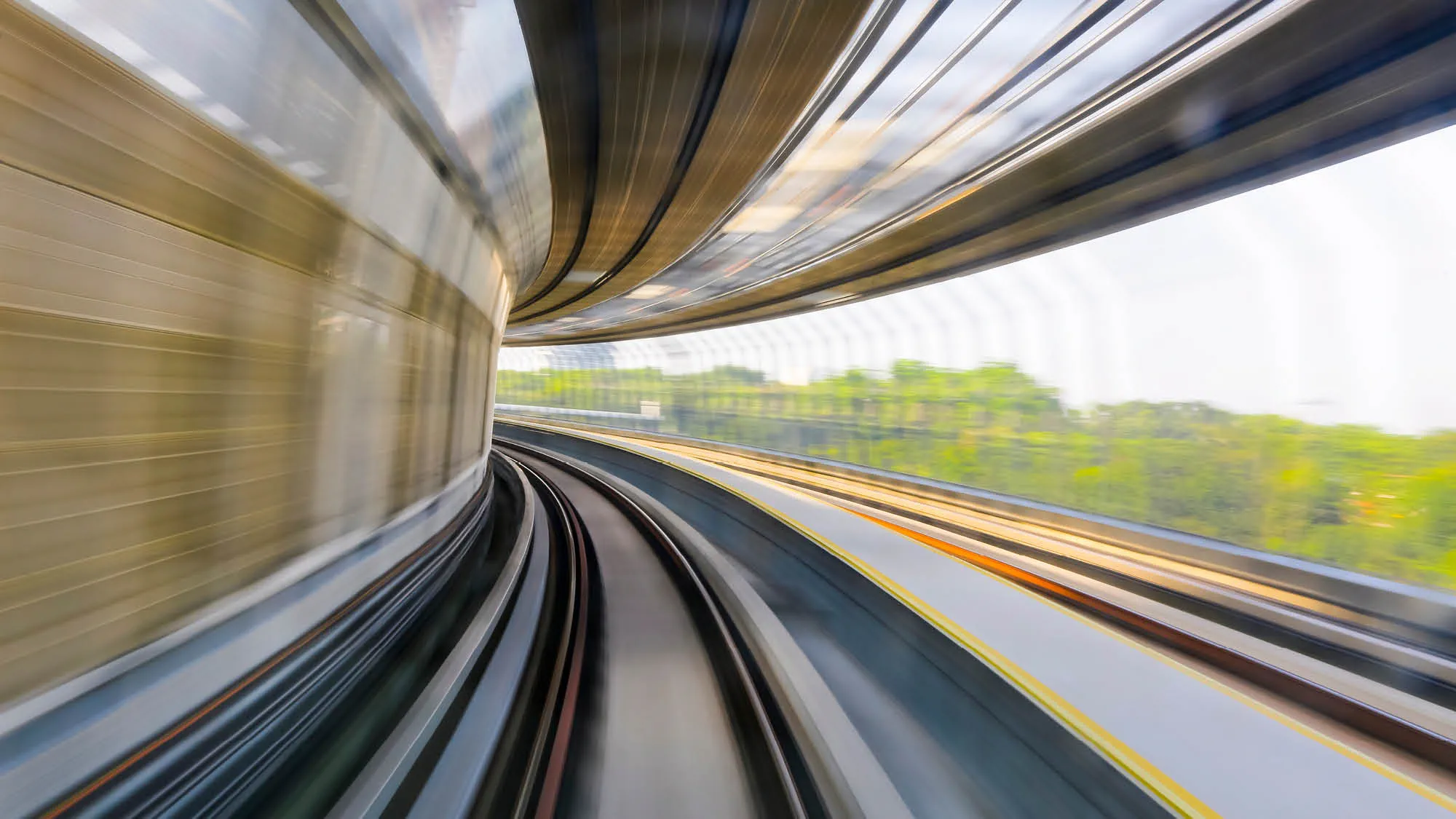 A blurred photograph of a rail line