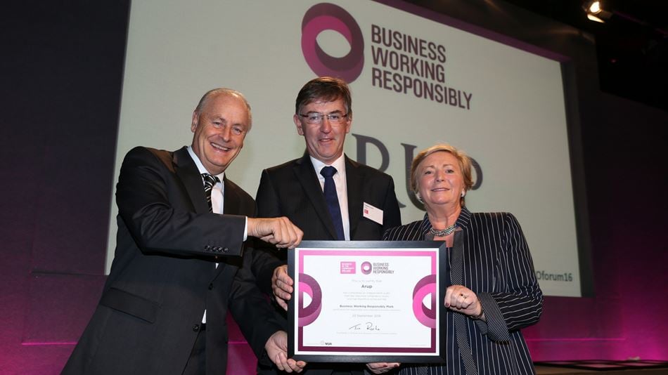 Eoghan Lynch, Chairperson of Arup in Ireland, receiving the Business Working Responsibly Mark certificate from Maurice Pratt, Business in the Community Ireland and An Tánaiste, Frances Fitzgerald