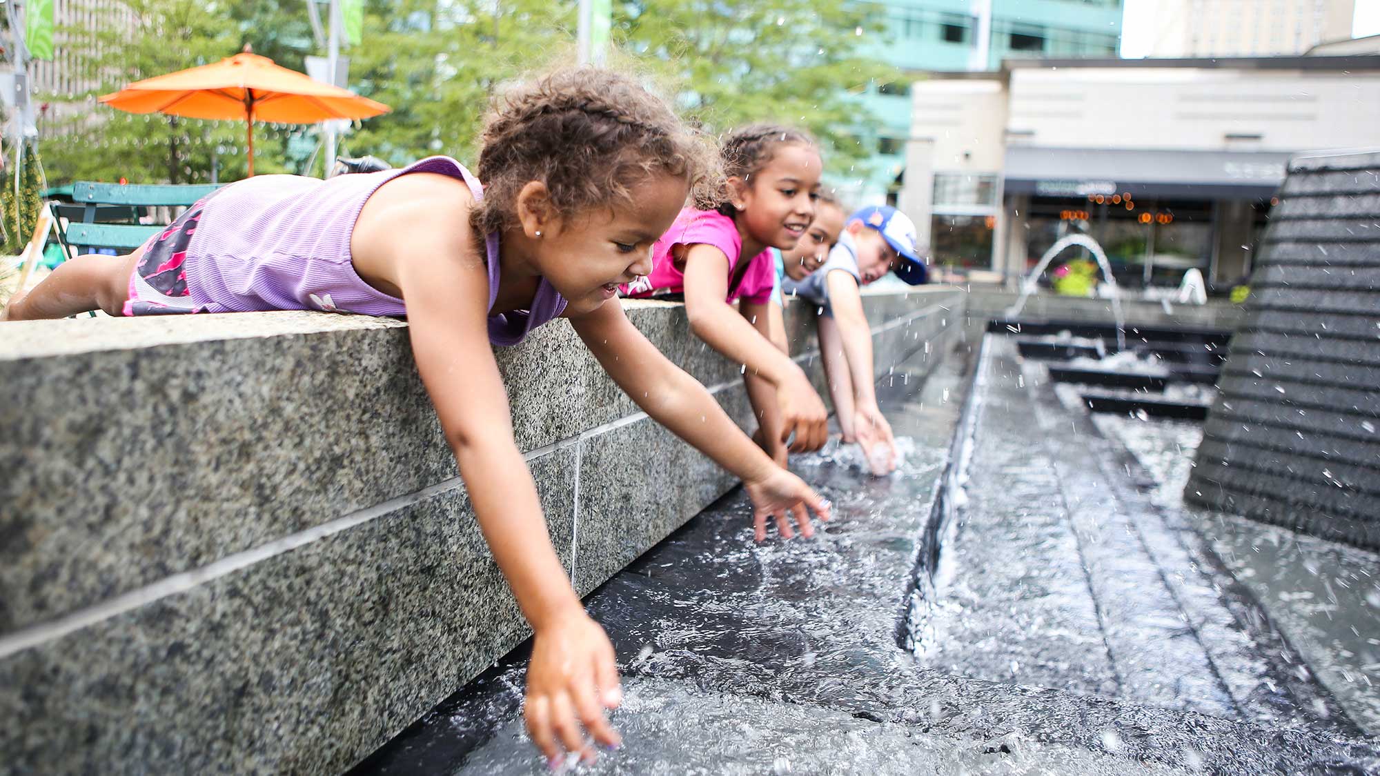 Children playing in fountain