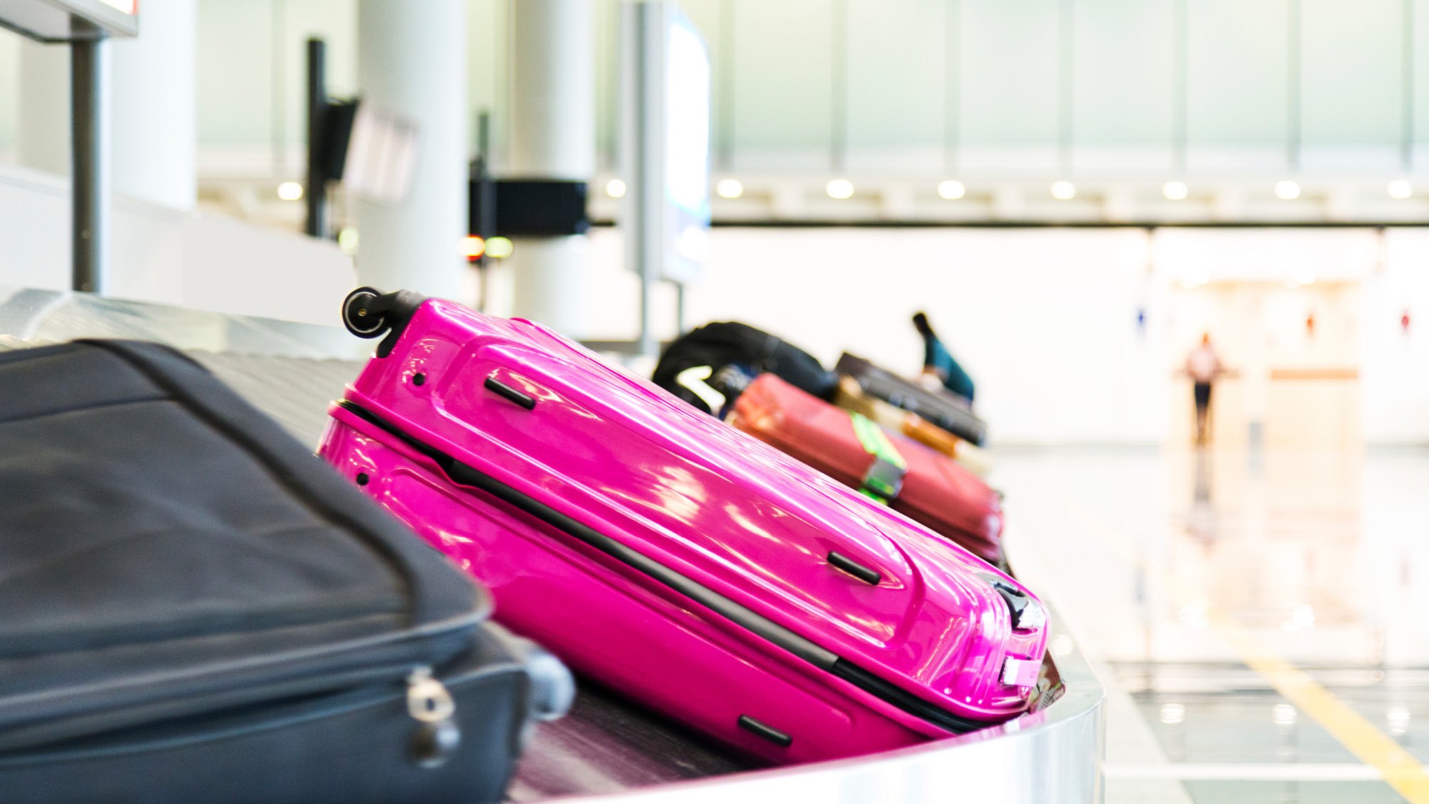 Suitcases and luggage on a carousel at an airport
