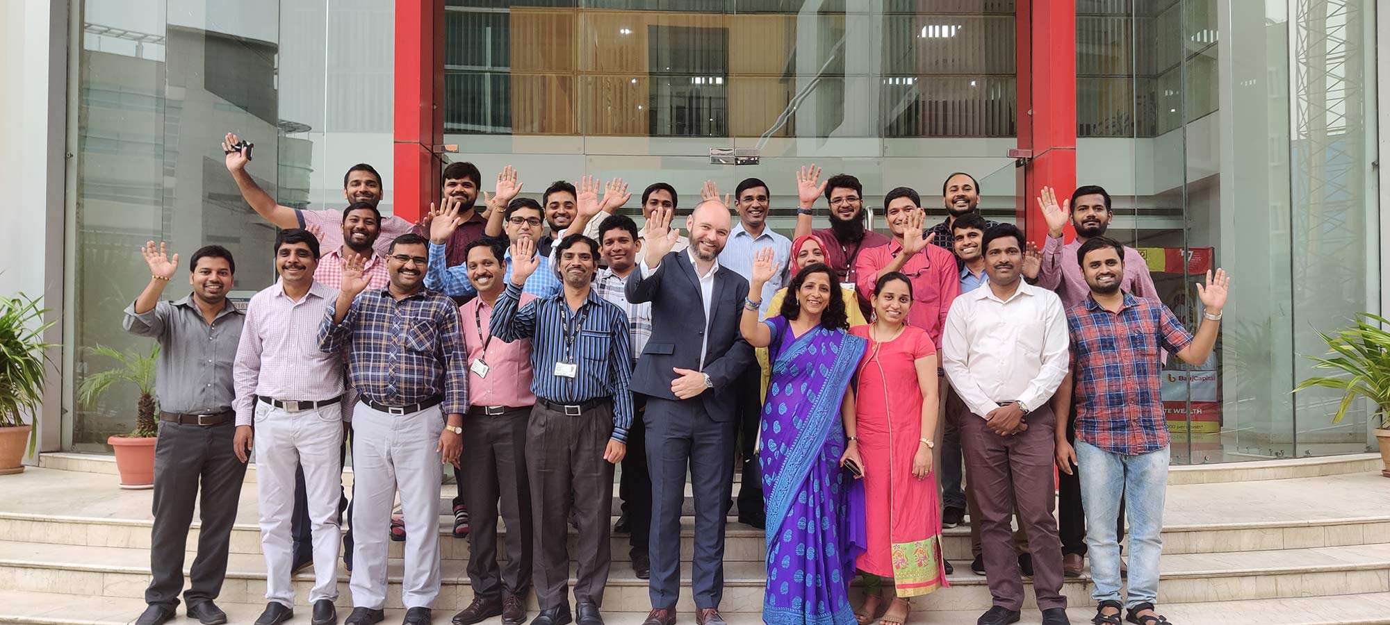 Staff in our Hyderabad office with Chief Information Officer Rob Greig