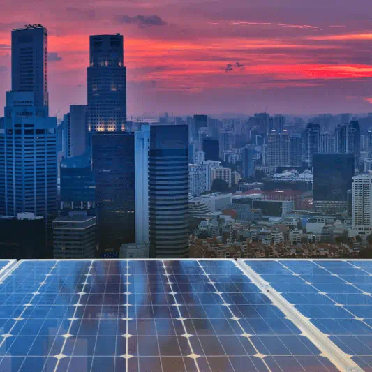 Solar panels in a city - combating climate change will require an energy transition to renewable energy sources