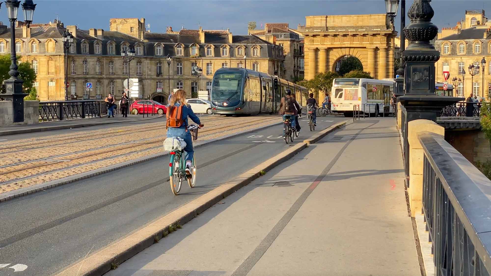 Metro line and cyclists in the city of Bordeaux - planning mobility and connectivity is an area of specialism