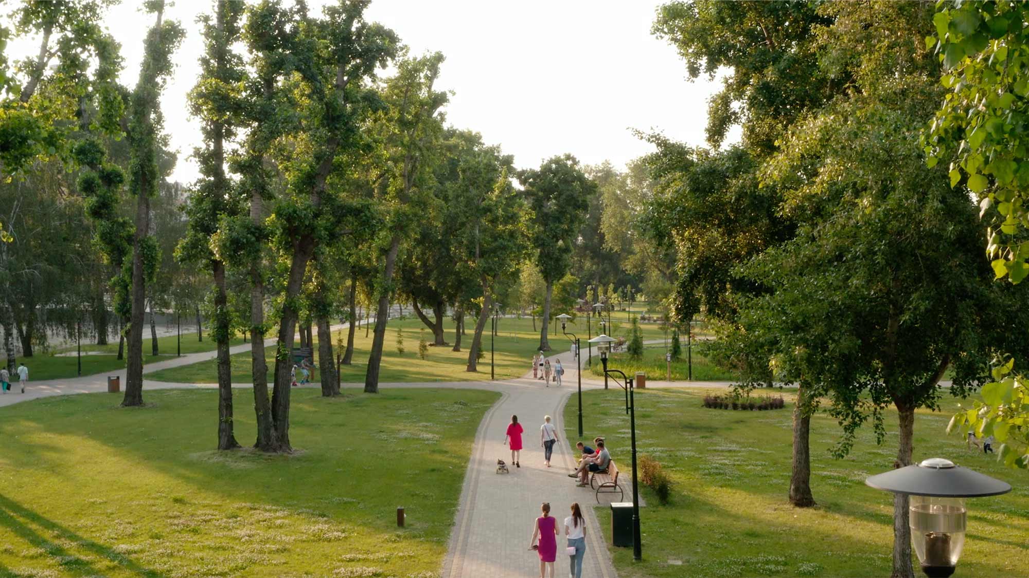 People walking in a city park - we help create brilliant places to live