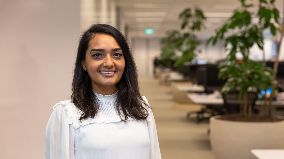 Devni Acharya smiling in Arup's Singapore office