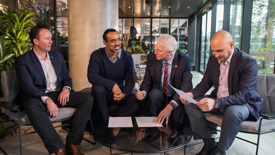 Pictured signing the agreement from left to right - Ross Campbell, Adam Goodes, Peter Chamley and George Mifsud