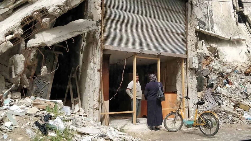 Re-opened shop in a ruined building in Homs_ Source Zaher Abdelmawla