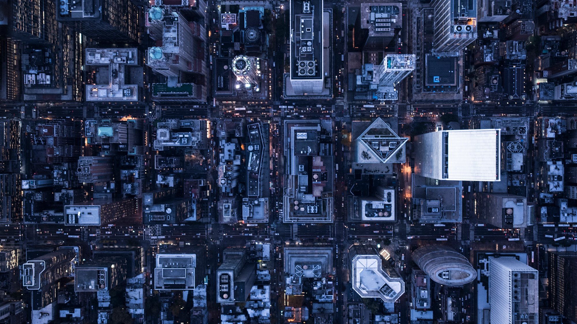 Aerial view of a large modern city at dusk