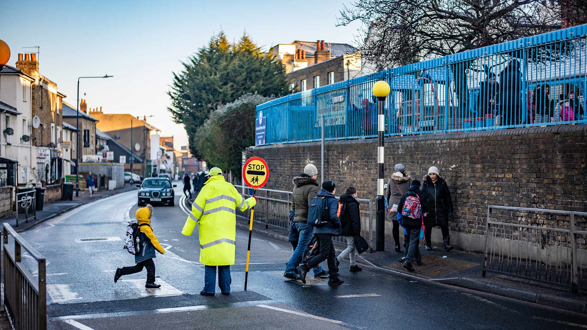 Children crossing the road on a pedestrian crossing