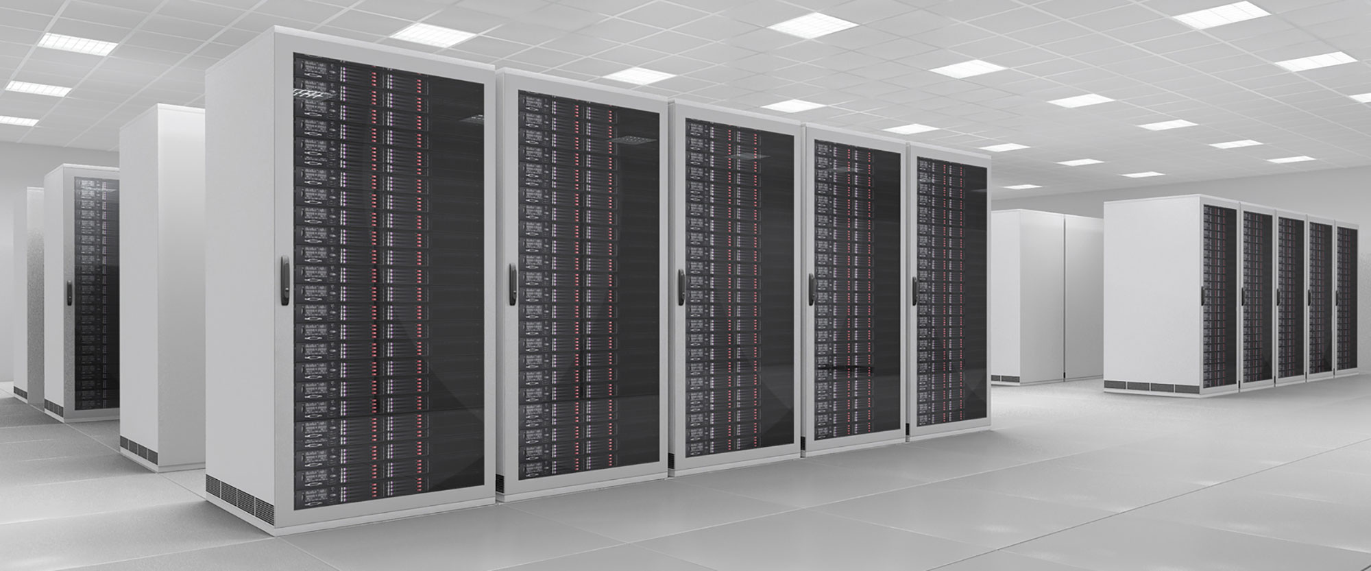 The interior of a modern data centre. Hard drives mounted in rows of racks.