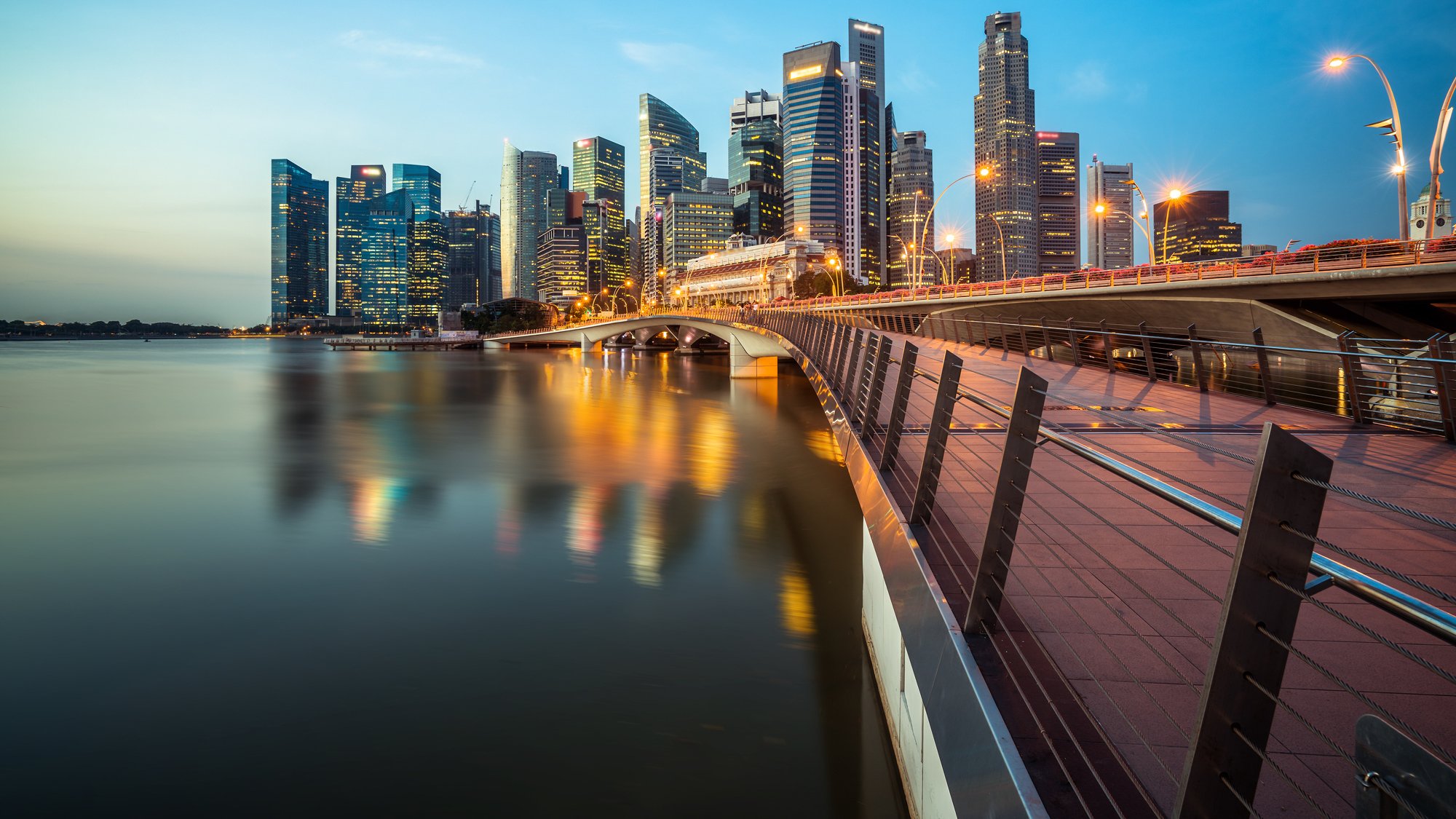 View of Singapore city over the water at dusk