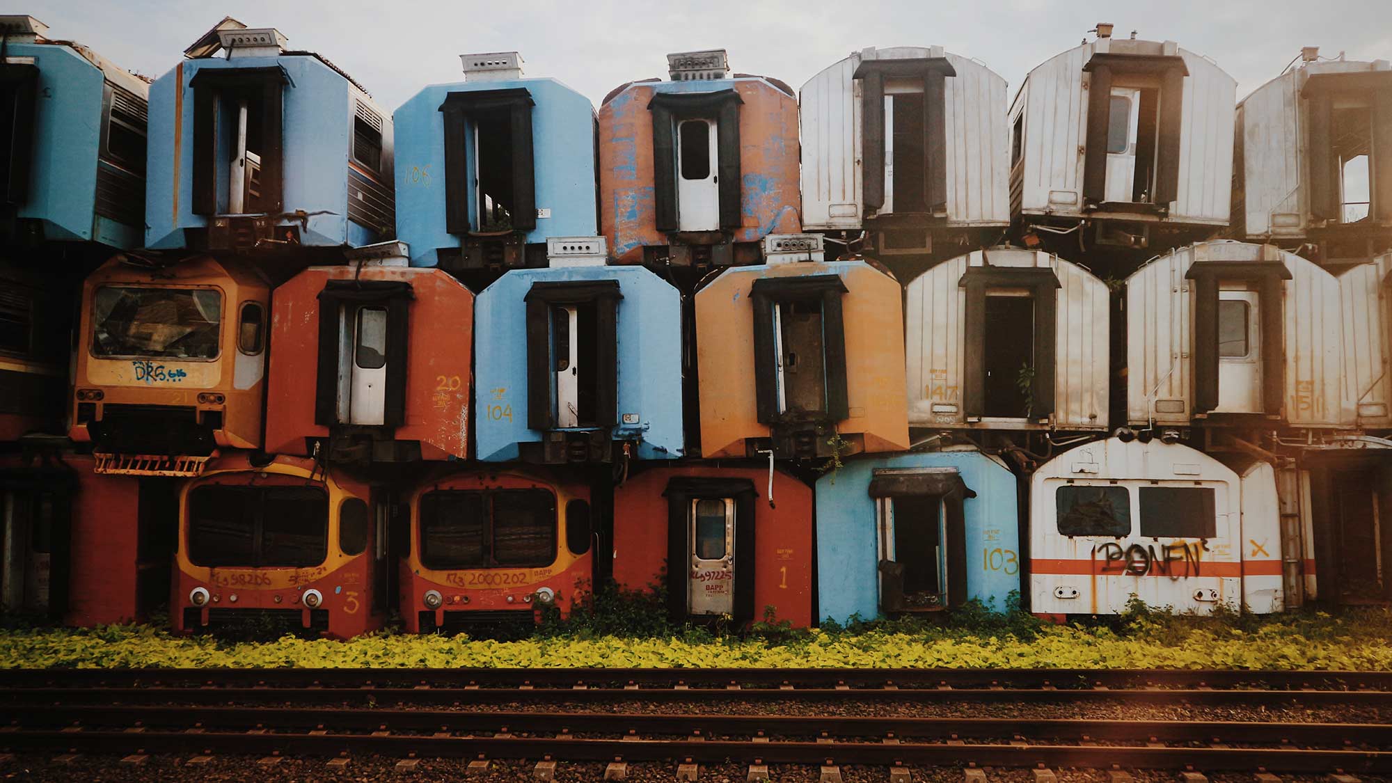 Old train carriages stacked upon one another