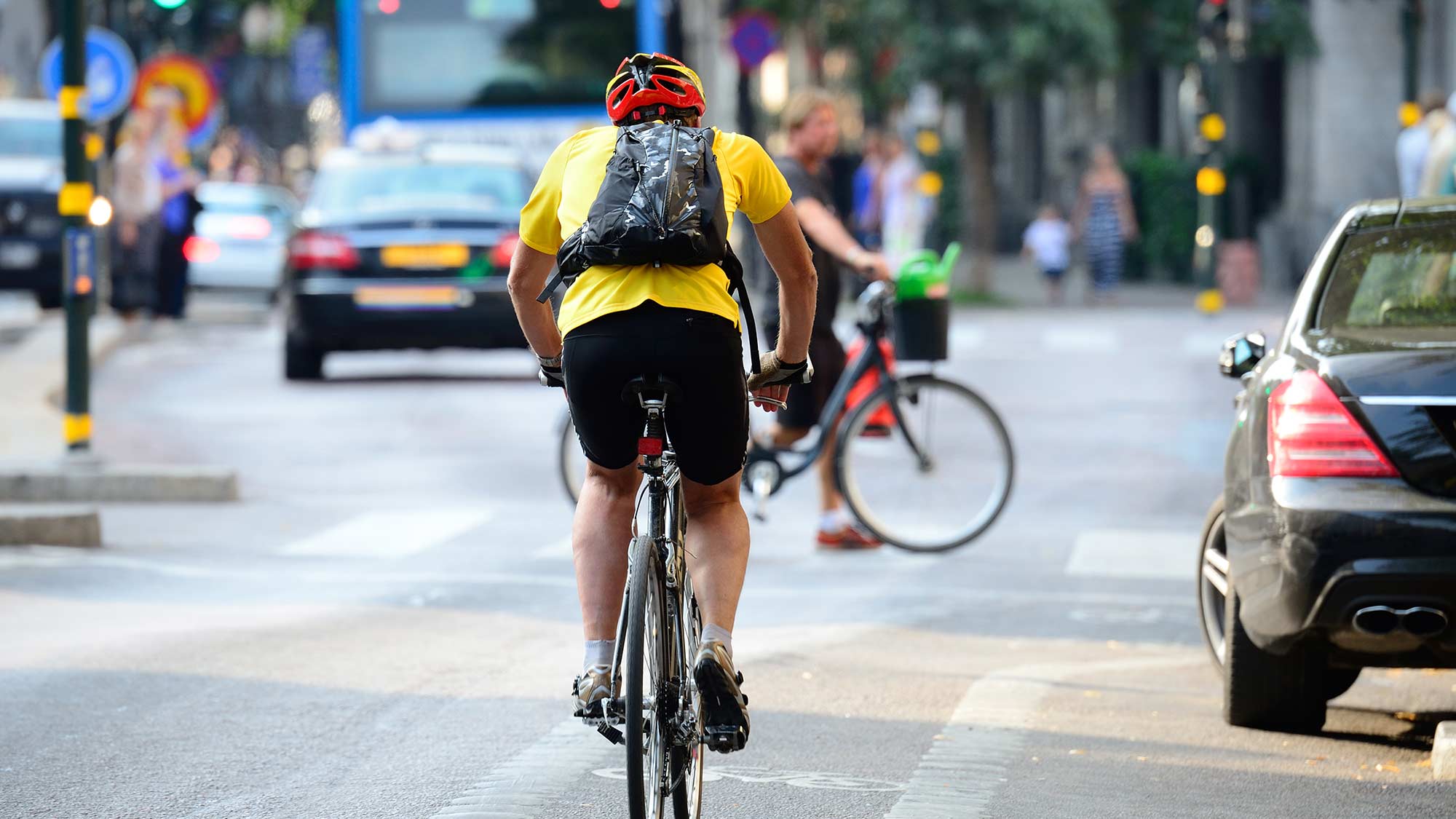 Man cycling city streets
