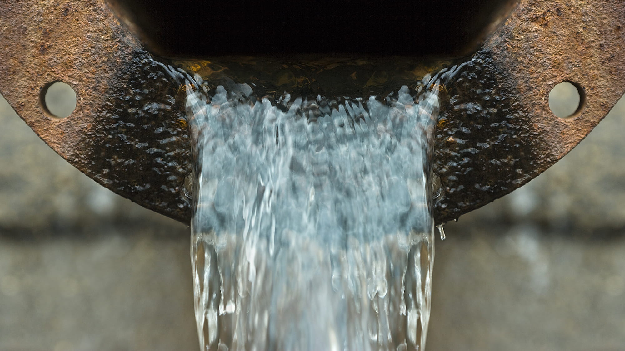 Water pouring out of drain
