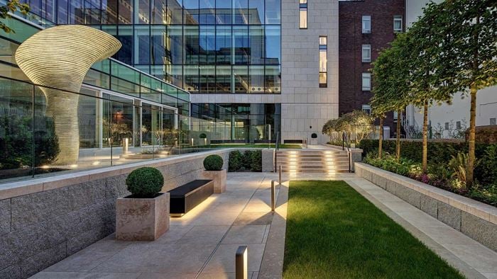 Courtyard in 10 Molesworth Street office building showing gardens and lighting features.
