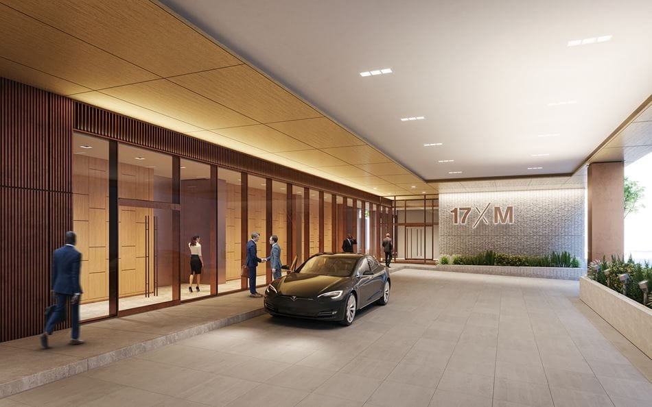 Digital rendering of a car and lobby entrance for the 17xM building. It is very modern, bright, and warm. 