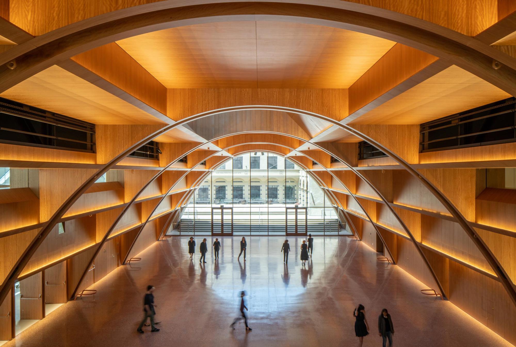 Curved, wooden interior lobby of the Audrey Irmas Pavilion