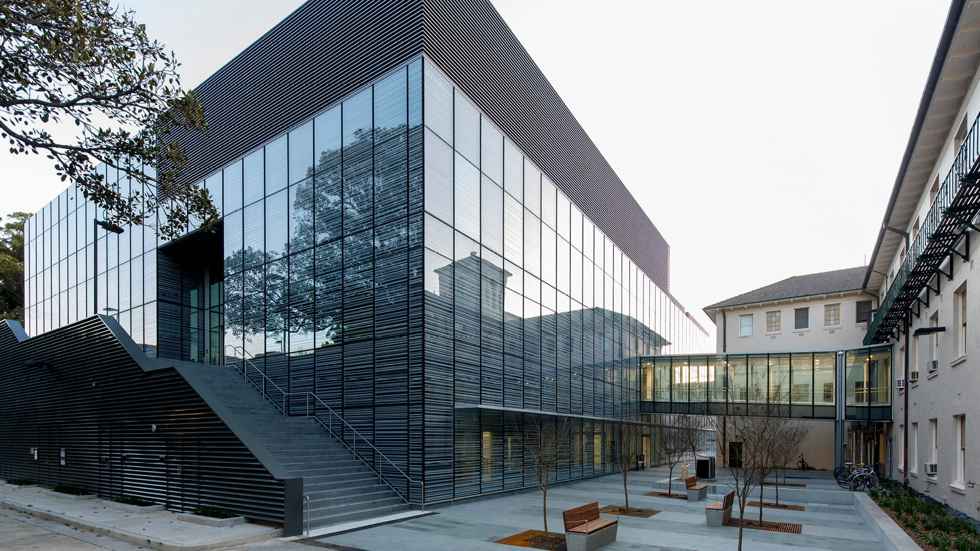 Exterior and courtyard of the nanoscale research centre building with reflections on the glass exterior