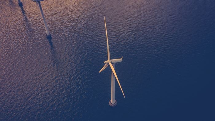 Aerial view of wind turbines in the deep ocean