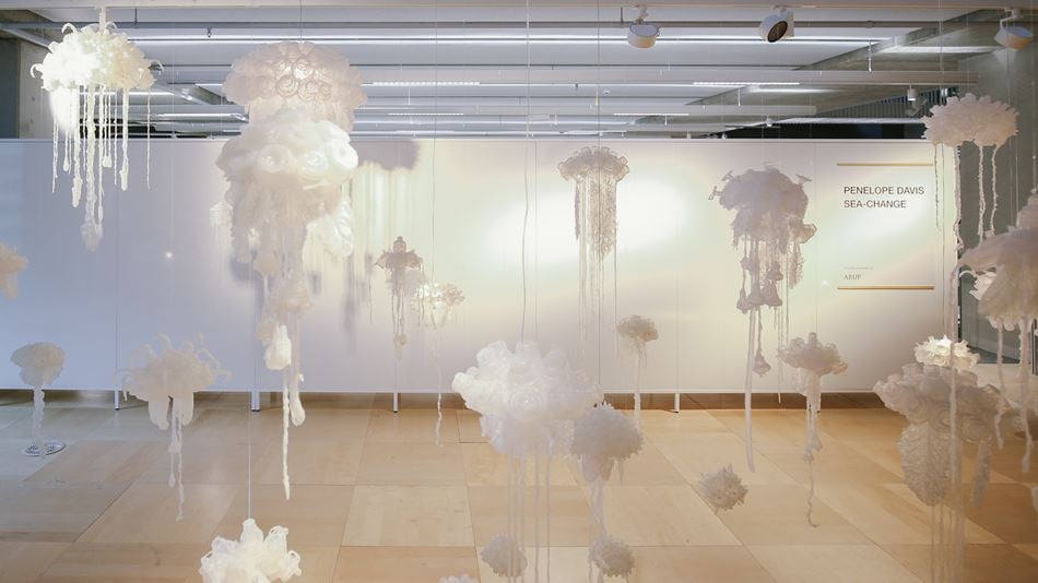 Jellyfish, made from recycled plastic, hang from the ceiling as part of the Sea Change exhibition