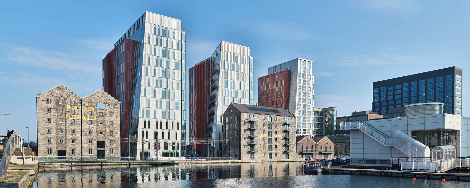 View of restored buildings and three new towers at Bolands Quay, with the grand canal in the foreground.