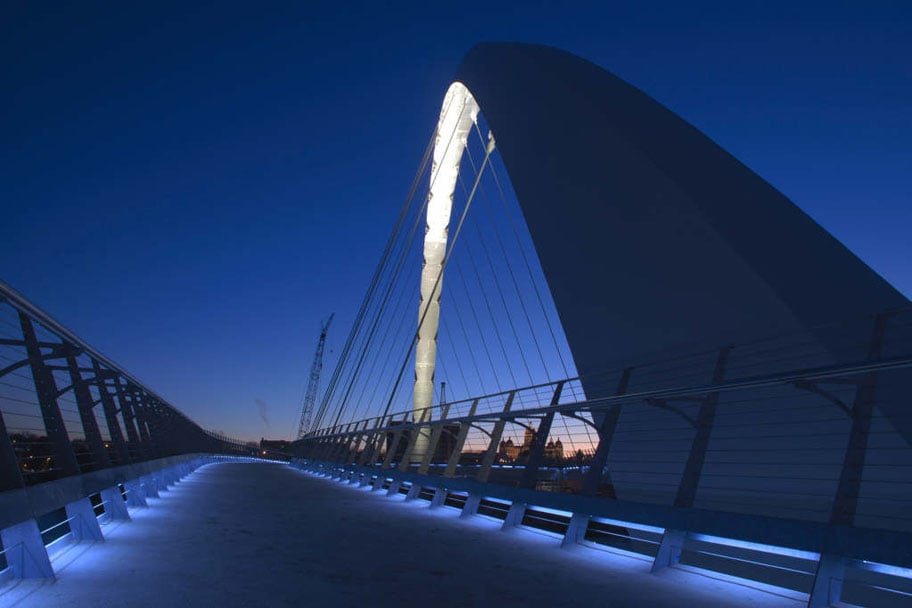 Center Street Bridge highlights its blue lighting.