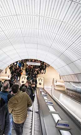 Passengers descend into a new Elizabeth line station on opening day