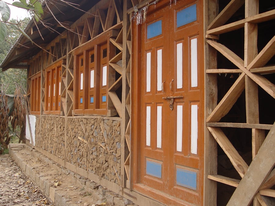Dhajji dewari construction is typified by a timber frame with stone and mud mortar infill.