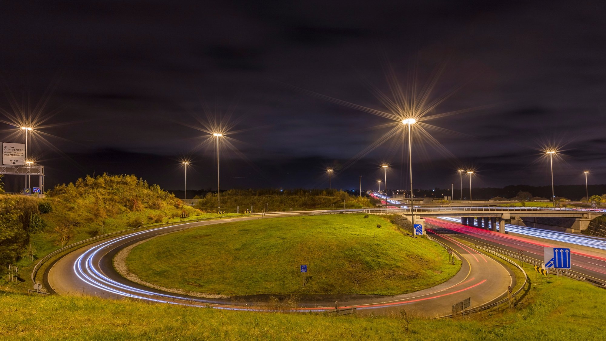 Ramp onto M50 motorway at night.