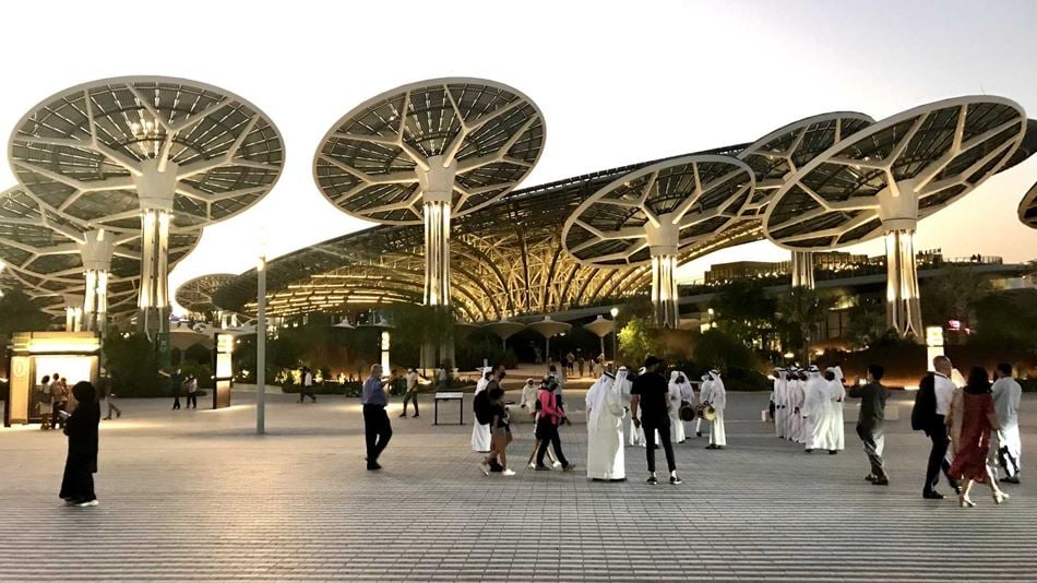 People walking at Expo Dubai 2020 at sunset