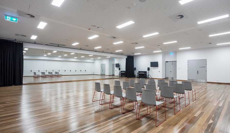 A large room with wooden floors and chairs, the rehearsal room, at Her Majesty’s Theatre in Adelaide ©Chris Oaten 
