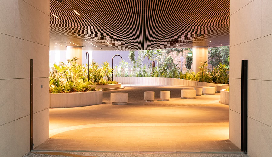 Modern office space with curved garden beds with plants, adaptable seating, open space, natural air, neutral colours