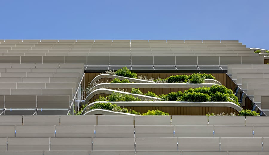 Commercial property in Brisbane. Close up view of curving balconies with plants