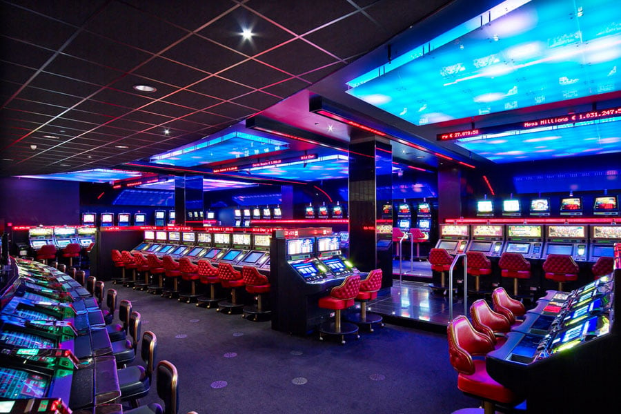 LED tickers in the slot machine area extend the excitement of gaming activity into the architectural space.