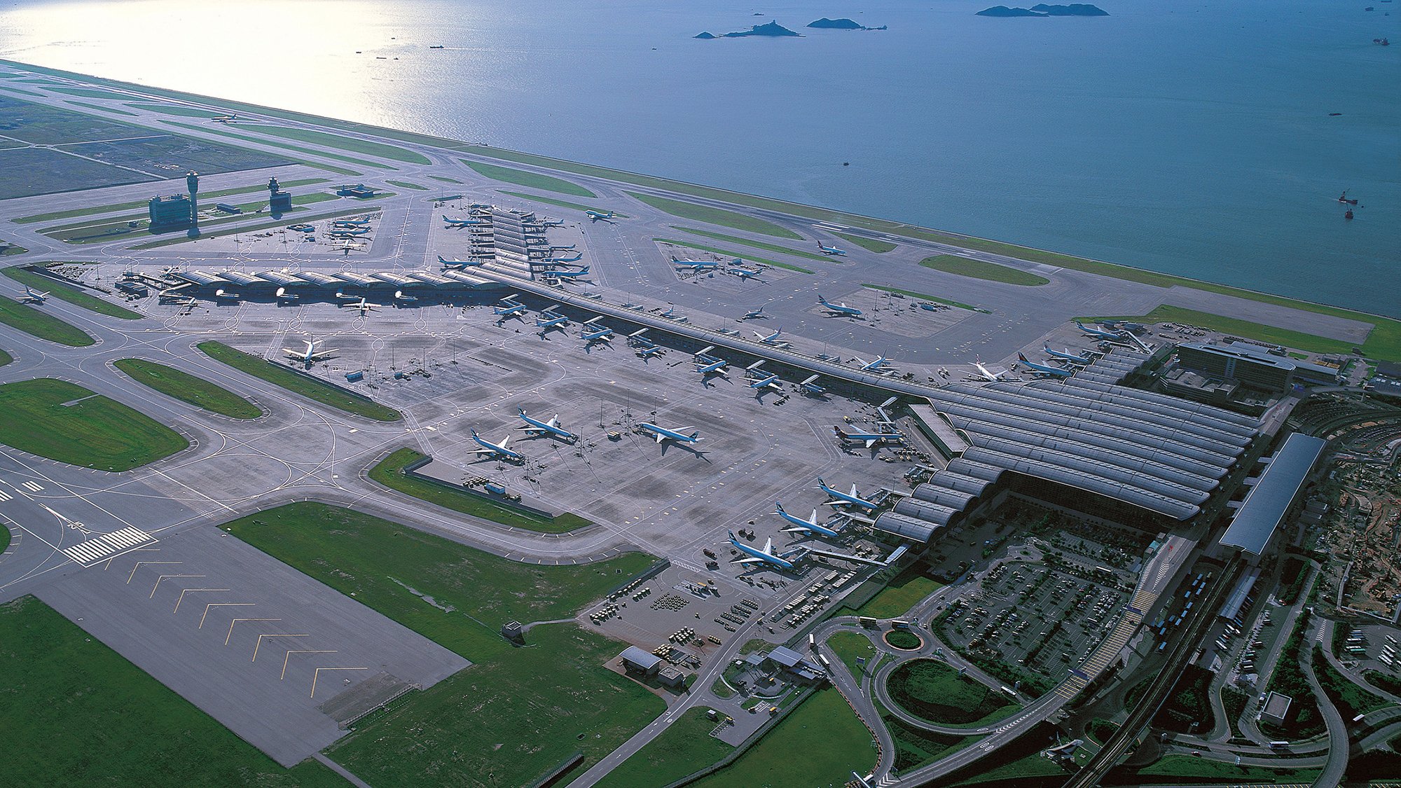 Arial view of Hong Kong International Airport showing the Y-shape of passenger terminal 1  ©Pacific Century Publishers Ltd