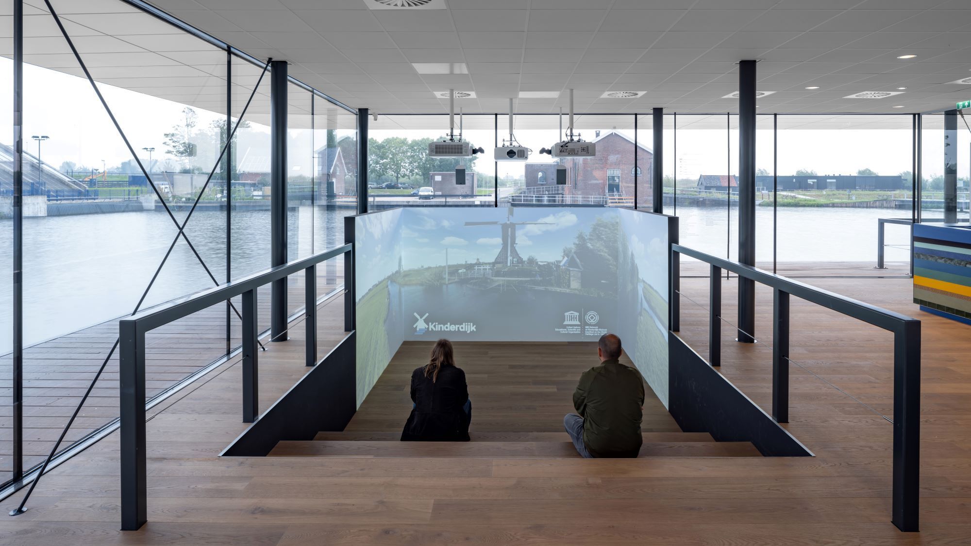 Two people enjoying the learning space at the visitor centre of Kinderdijk