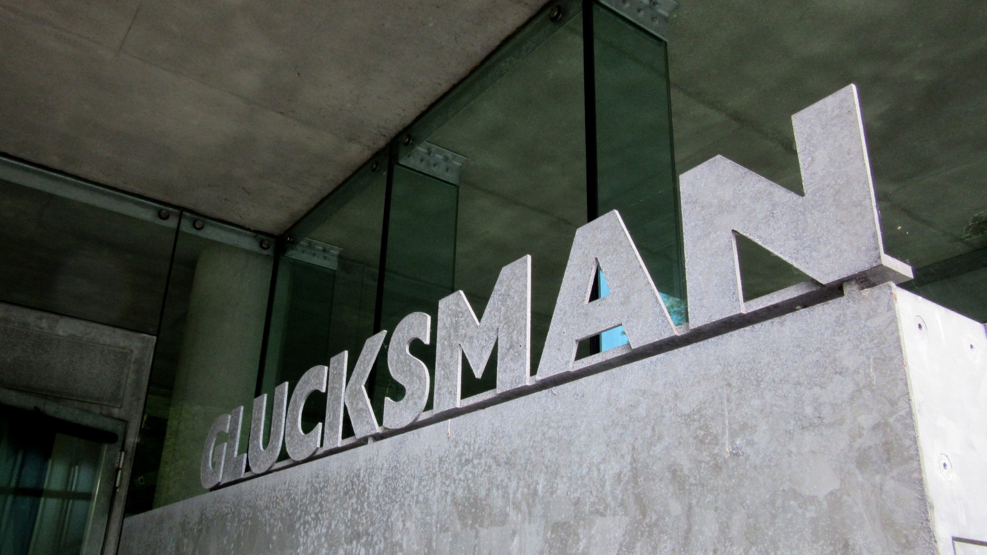 Stone sign saying Glucksman outside the Lewis Glucksman Gallery.