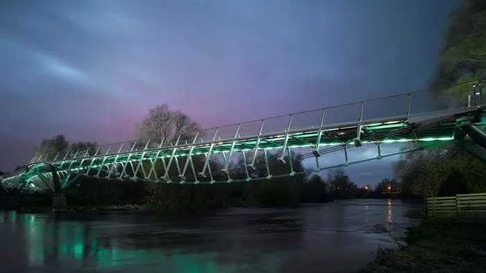 View of a section of the Living Bridge lit up at dusk.