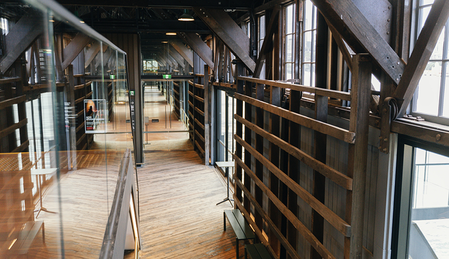 Inside a fit out in a building: exposed walls reveal timber beams