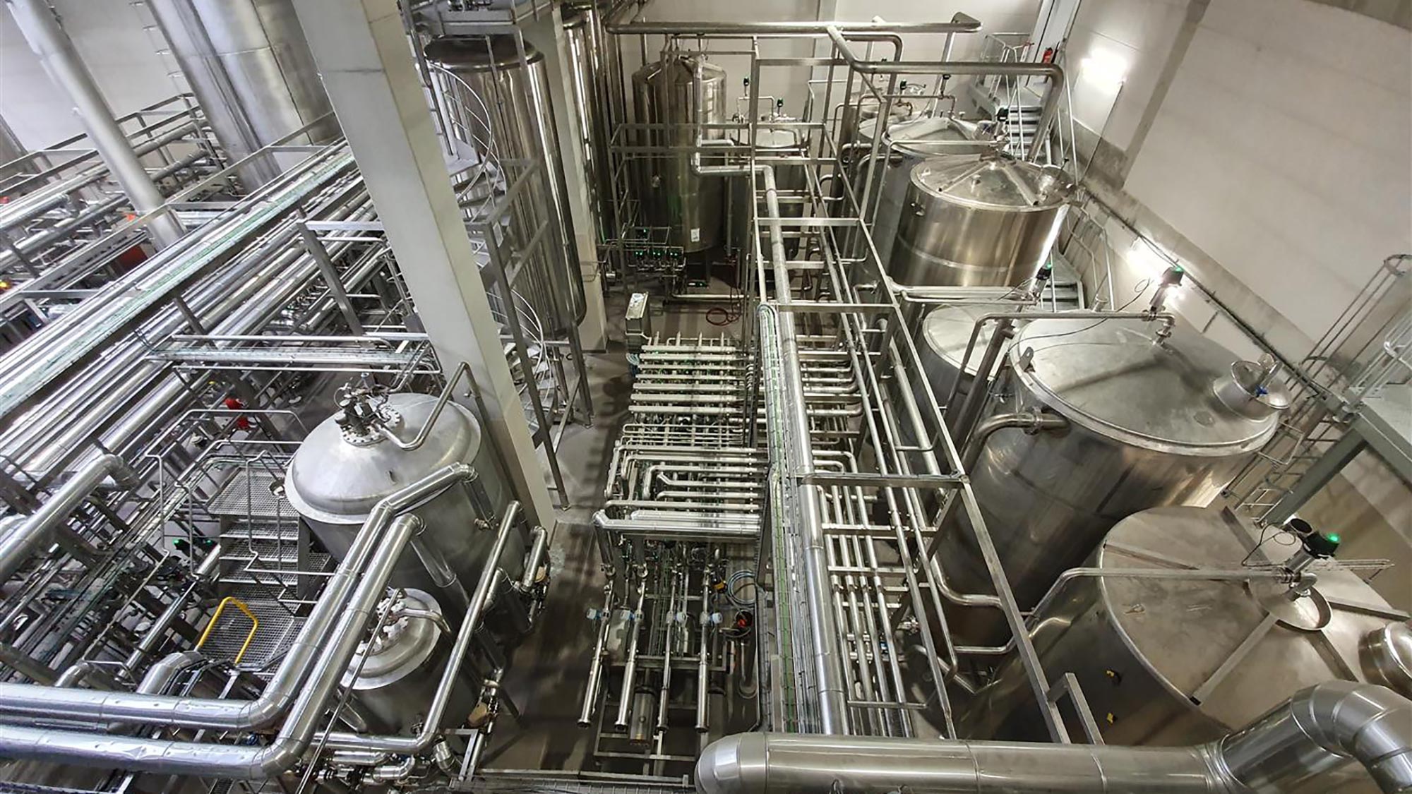 Beer Processing Area – view from pipebridge walkway. This is a complex area with many processes; yeast propagation, fermentation, filtration, and chilling.