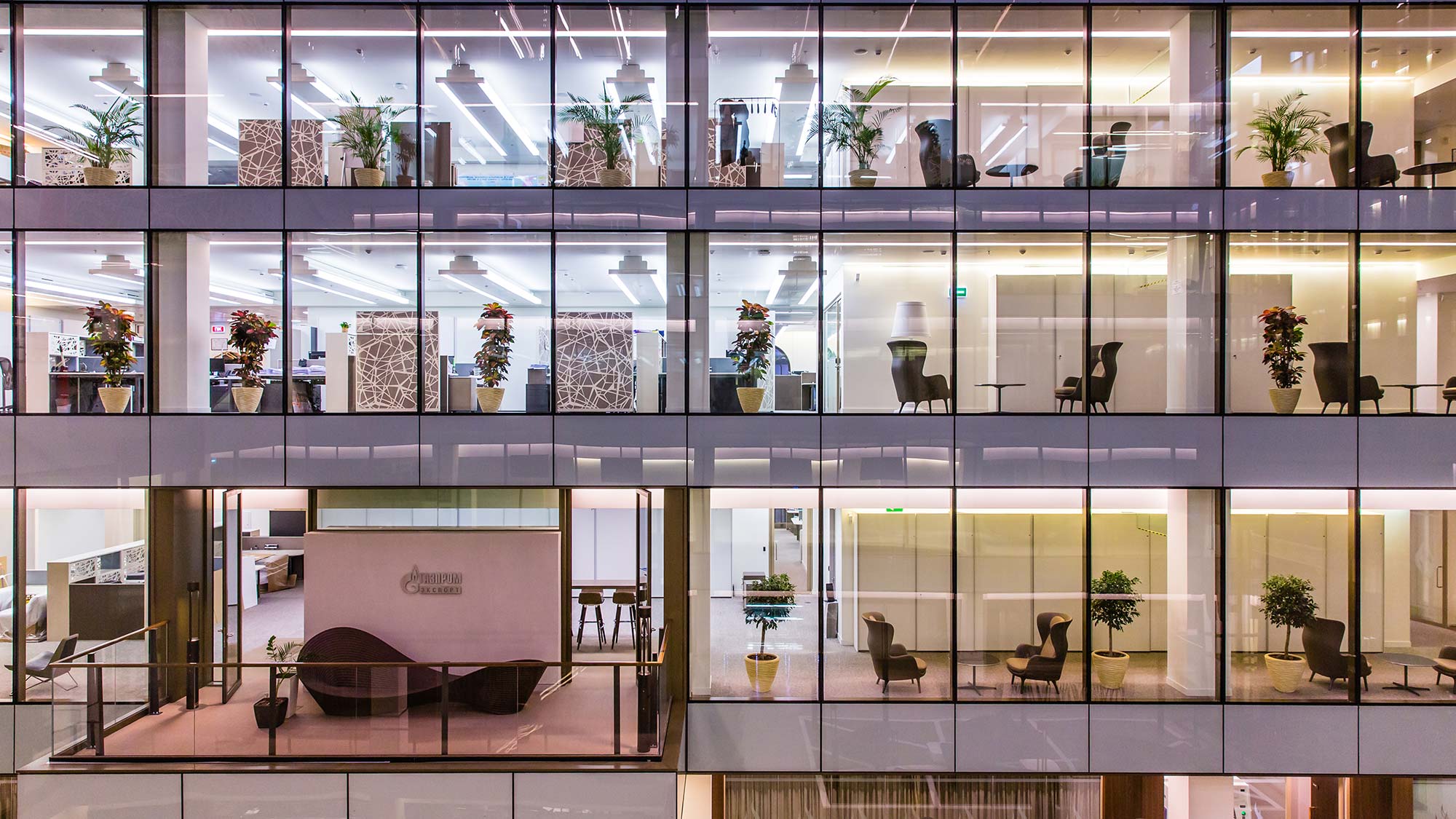Office spaces behind large glass windows at St Petersburg headquarters