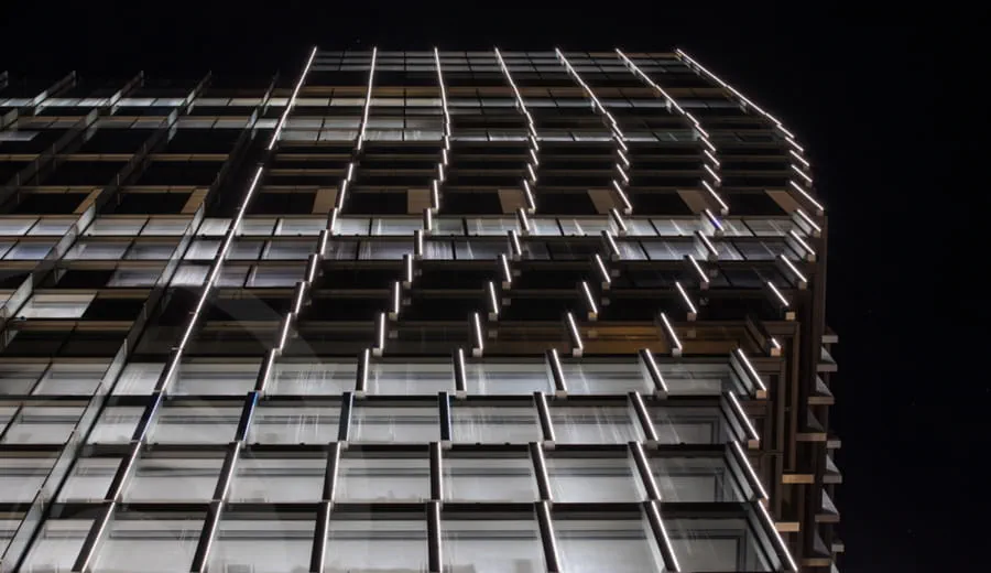 Looking up at the lit side of Sixty Martin Street Sydney at night