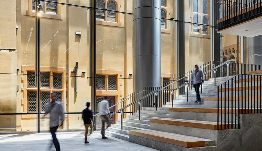 Inside the large, open foyer with glass walls of Sixty Martin Street Sydney