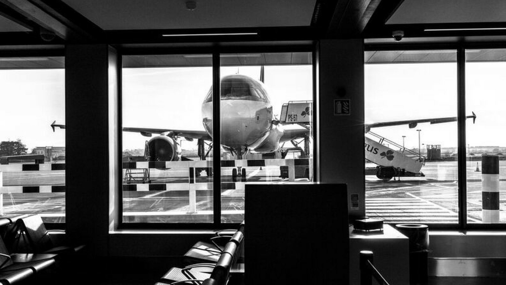 View of airplane through windows at South Gates, Dublin Airport