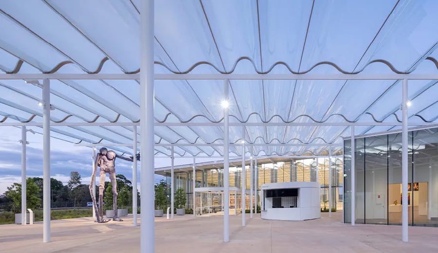 Large outdoor space under a white cover at Art Gallery of New South Wales Sydney Modern Project. 
