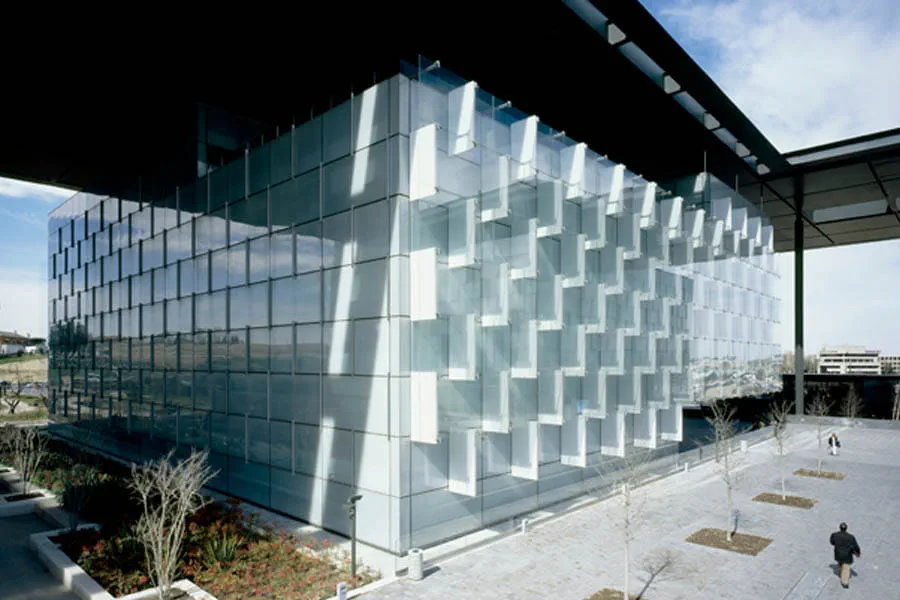 The inside skin glass is ceramic fritted in white dots, making the buildings look like a group of ice blocks.