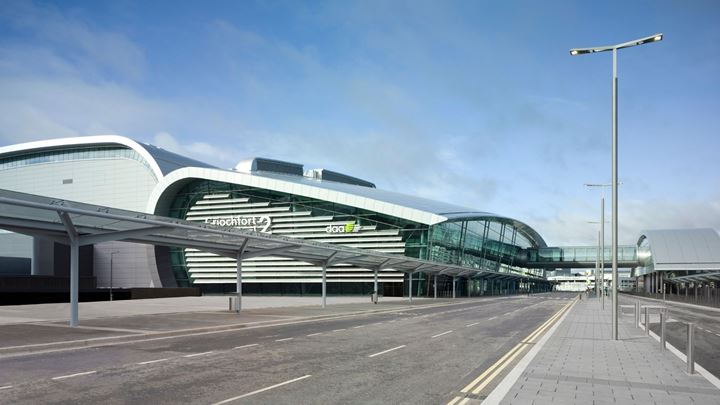 Terminal 2 at Dublin Airport, showing the access road in the foreground with a passenger walkway bridge above it.