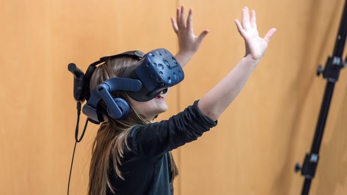 A child experiencing a city through Urban95 virtual reality