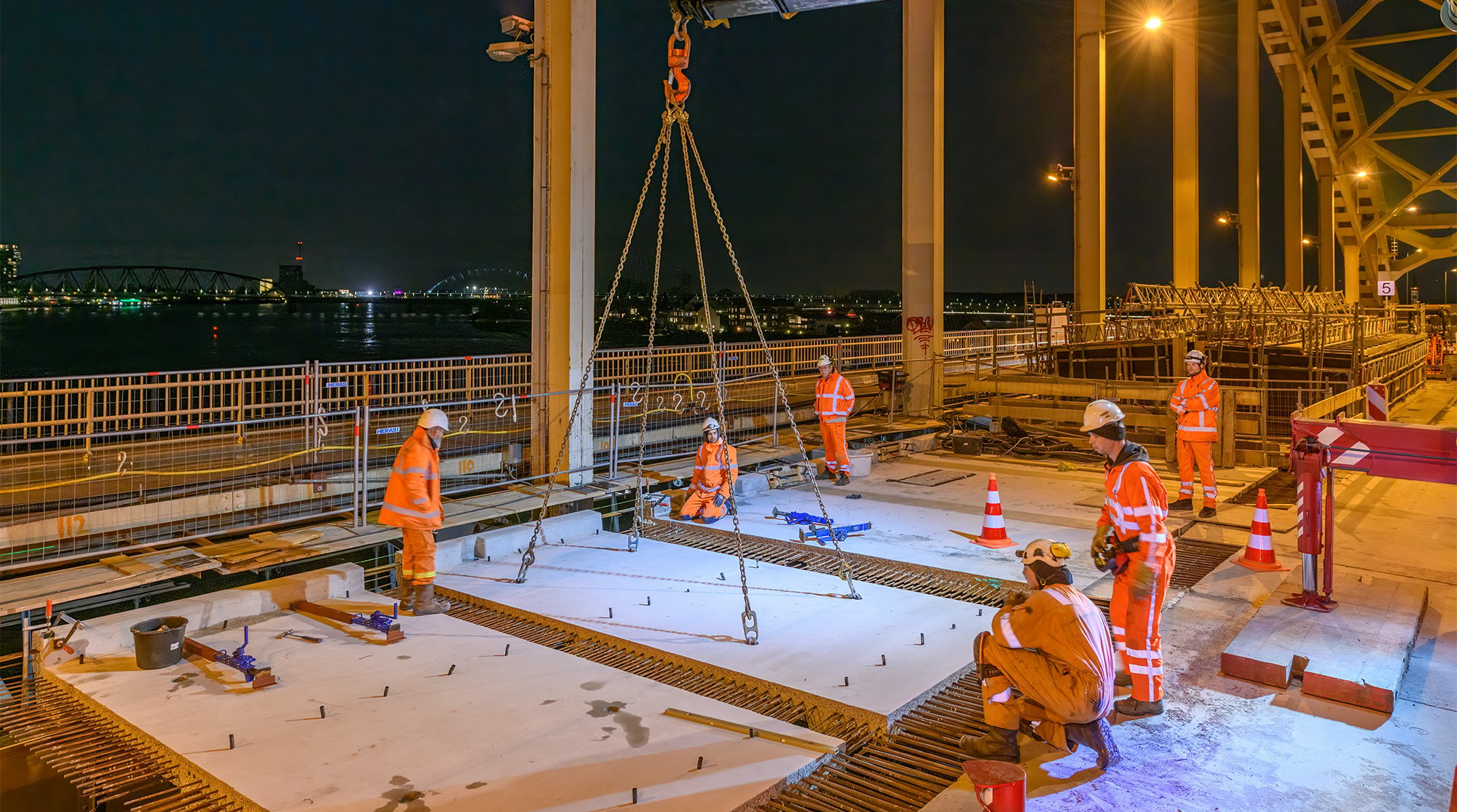 Waalbrug bridge with operational team on site placing the concrete deck.