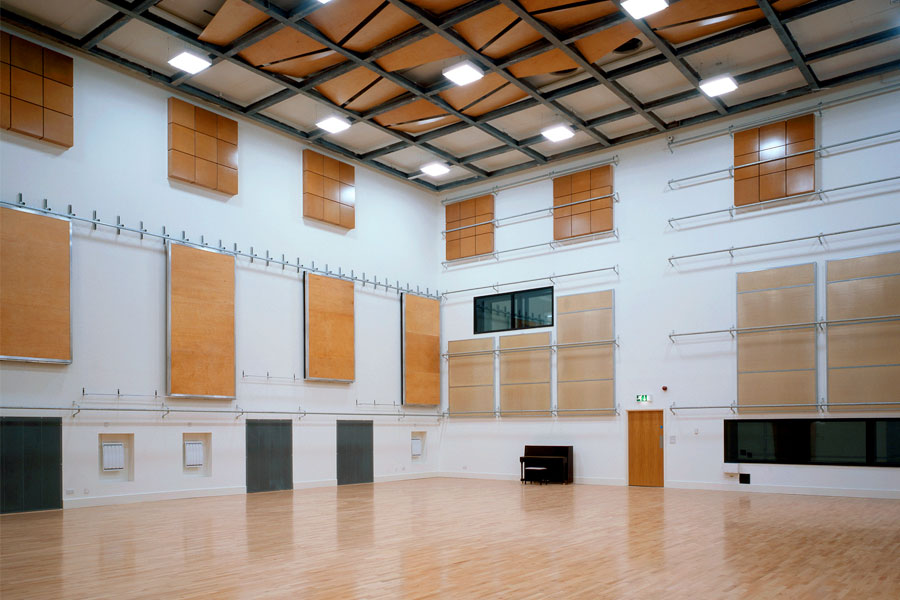 Unique solutions have been found to the acoustic and aesthetic requirements of performance and rehearsal spaces.